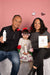 Haetsia founders Angelica and Antoine with their daughter, holding Haetsia haircare products – family behind the clean beauty brand