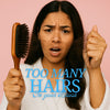 Woman frustrated by hair breakage and hair loss, holding a hairbrush full of strands – visual for Haetsia Revitalizing Shampoo campaign