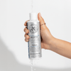 Haetsia La Renaissance Revitalizing Shampoo – clean revitalizing shampoo with royal jelly, biotin, and bergamot, shown in hand under running water