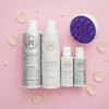 Haetsia Revitalizing Set – La Renaissance Shampoo and La Primavera Conditioner with scalp brush on pink background