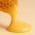 Royal jelly flowing from honeycomb – nourishing natural ingredient in Haetsia Revitalizing Shampoo for hair repair and vitality